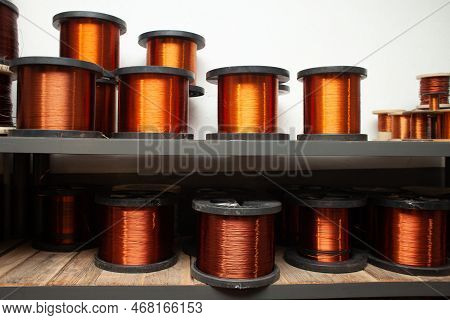Many Coils Of Copper Wire In The Production Workshop, Winding Copper Cable On Spools