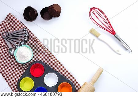 Top View Set Of Kitchen Utensils And Ingredients For Bakery On White Background. Materials Or Kitche