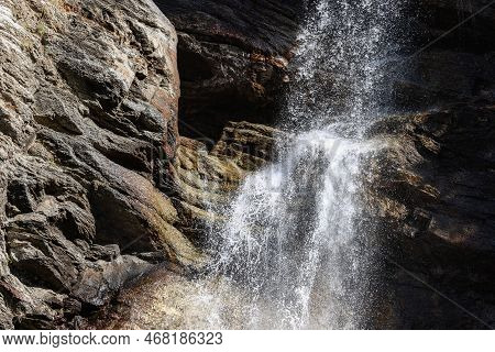 Gloomy Centuries-old Layers Of Karst Granite Rocks Are Washed By Falling Water Of Lillaz Waterfall (