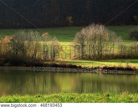 Autumn Sunny Landscape By The Lake. The Leaves Were Already Falling.