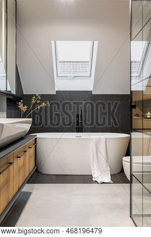 Stylish Interior Of Bathroom With Bathtub, Shower, Towels And Other Personal Bathroom Accessories. M