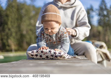 Happy Family. Young Mother Playing With Her Baby Boy Infant Oudoors On Sunny Autumn Day. Portrait Of