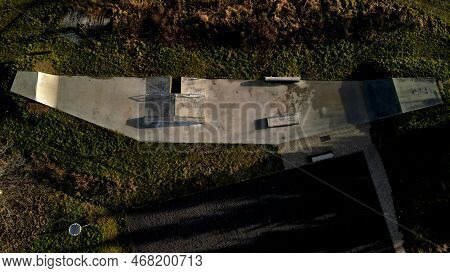 Skateboard Park With Concrete Cement Surface With Concrete Skateboard Obstacles Is Designed For Roll