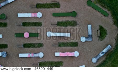 Minigolf Course In Park Catch Golf Balls Behind Obstacle. Game For Points Below Par Or Above Par, Re