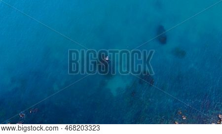 A Scenic Top-down View Over Blue Water Of The Bolata Coast Cliff, Kaliakra Region In Bulgaria - Aeri