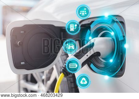 Electric Car Power Cable Plugged Into Car Charging Station Booth Futuristic Modern Technology Loadin