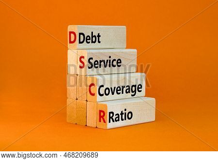 Dscr Debt Service Coverage Ratio Symbol. Concept Words Dscr Debt Service Coverage Ratio On Wooden Bl