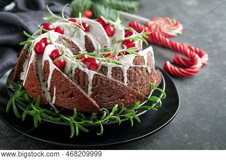 Christmas Chocolate Bundt Cake. Traditional Christmas Fruit Cake With White Glaze, Cranberries And R