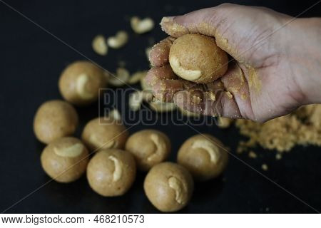 Preparation Of Moong Dal Laddu In A Ball Form With Hand. It Is A Protein Rich, Indian Sweet Made Of
