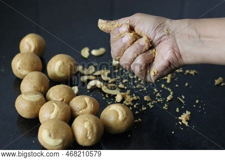 Preparation Of Moong Dal Laddu In A Ball Form With Hand. It Is A Protein Rich, Indian Sweet Made Of
