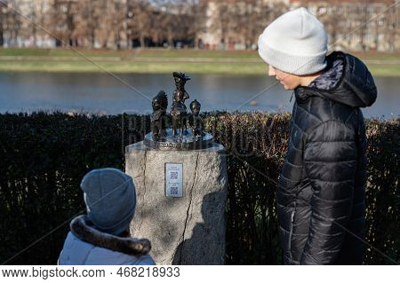 Uzhgorod, Ukraine- January 2, 2023: Kids Near Buffalo Bill Wild West Mini Sculptures.