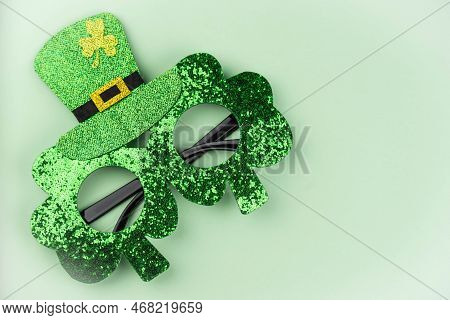 Green Glasses With Shamrock For Saint St Patrick’s Day Holiday Celebration On Green Background. Funn
