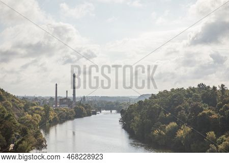 Autumn Scenery With Colorful Trees Reflected In The Water. Pedestrian Bridge Across Teteriv River, Z