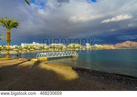 Eilat, Israel - January 15, 2022: Winter Scene On The Beach, With Visitors And Hotel Buildings. Eila