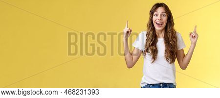 Surprised Cheerful Celebrating Girl Lively Discuss Near Awesome Event Pointing Up Index Fingers Smil