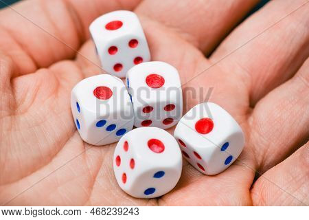 Close Up View On Dice On The Palm. Yahtzee Is A Dice Game. All Five Dice The Same Number - One.