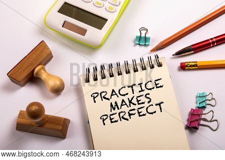 Practice Makes Perfect. Stationery On A White Office Table