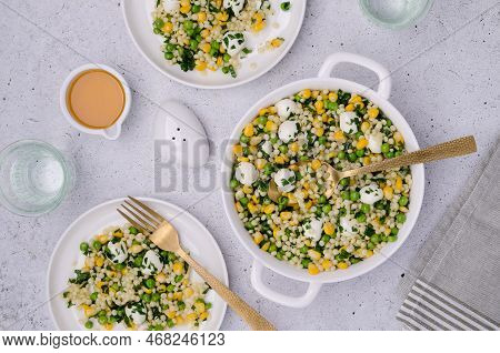 Salad Of Vegetables, Pasta And Mozzarella In A Dish On A Light Background. Top View.