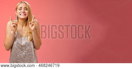 Nervous Hopeful Blond Young Woman In Silver Trendy Dress Close Eyes Grimacing Eager Wish Come True C