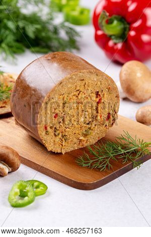Mushroom Based Vegan Sausage With Vegetables And On Wooden Board, Top View