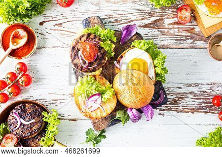 Making Homemade Burger. Ngredients For Cooking On A Wooden Table. Top View.