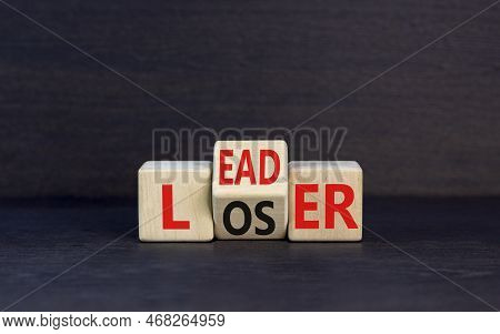 Leader Or Loser Symbol. Concept Word Leader Loser On Wooden Cubes. Beautiful Black Table Black Backg