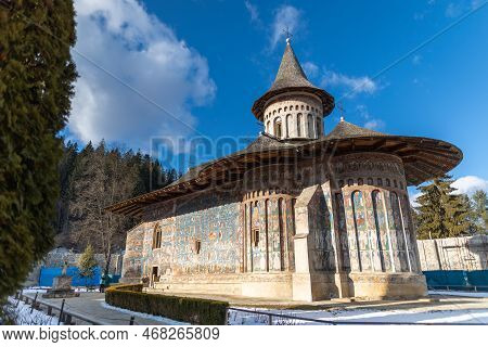 Landscape Shot Of The Old Painted Medieval Voronet Monastery, Famous For The Blue Shade Of Vornet.