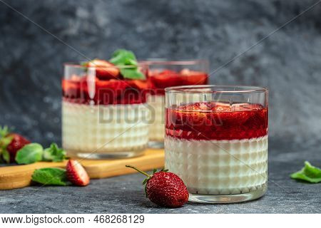 Panna Cotta Vanilla With Strawberry Sauce Jelly And Mint. Italian Dessert, Place For Text.