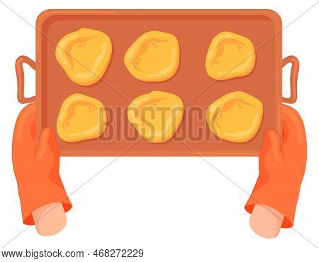 Baking Tray With Raw Cookies In Oven Mitt Hands Isolated On White Background