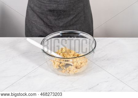 Mixing Ingredients In A Glass Mixing Bowl To Prepare Mermaid Cakesicles.