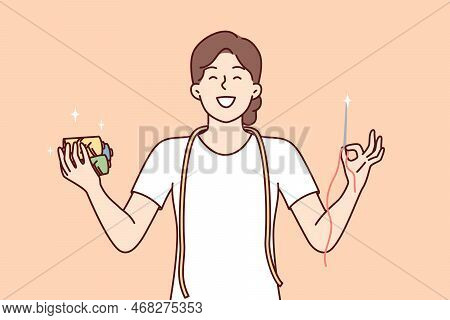 Woman Seamstress Holds In Hands Sharp Needle And Multi-colored Threads For Making Individual Clothes