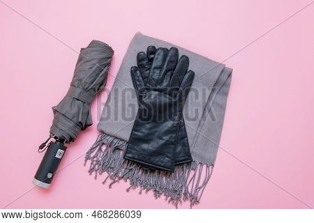 Autumn Accessories Umbrella, Gloves And Tippet On Pink Background