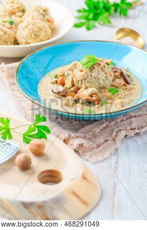 Homemade Bavarian Bread Dumpling, Called In South Germany As Semmelknoedel With Creamed Mushroom Sau