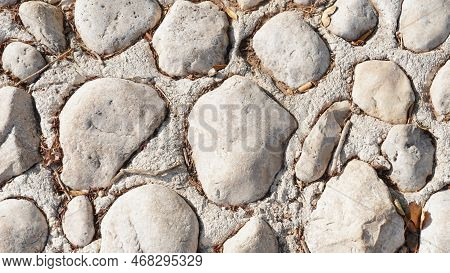 Texture Of A Stone Wall. Part Of A Stone Wall, For Background Or Texture