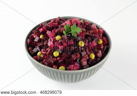 Russian Vinegret Salad Of Boiled Beets, Potatoes, Carrots And Green Peas On A White Background. Beet