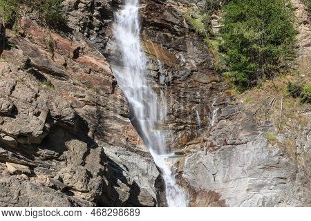 Сlose-up View Of Water Stream Of Lillaz Waterfall (cascate Di Lillaz) On Granite Ledges Of Rock With