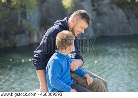 Happy Family. Father Playing With Son  Oudoors. Positive Human Emotions, Feelings, Joy On The Lake  