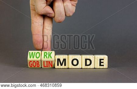 Work Or Goblin Mode Symbol. Concept Word Work Mode Goblin Mode On Wooden Cubes. Businessman Hand. Be