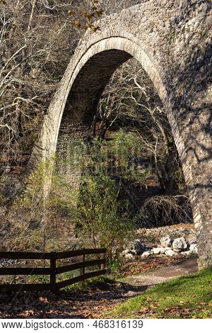 Ancient, Stony, Arched Bridge St. Vissarion On The Portaikos River In The Sunny Day (thessaly Region