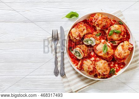 Chicken Rollatini With Spinach Ricotta Filling In Marinara Sauce Topped With Mozzarella Cheese And F