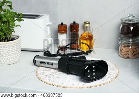 Thermal Immersion Circulator On Table In Kitchen. Sous Vide Cooking