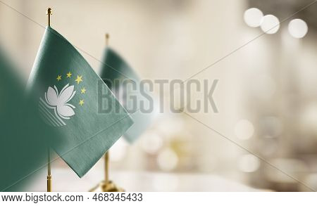Small Flags Of The Macao On An Abstract Blurry Background