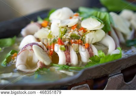 Steam Squid With Chili And Lemon Sauce - Pla Muk Nung Manow. Spicy Seafood Served On Hot Pot.