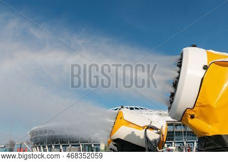 Snow Cannons Spray Artificial Snow Crystals. Snow Guns. Production Of Artificial Snow. Cars Make Sno