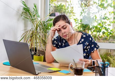 Businesswoman Entrepreneur Looking Documents Report In Modern Bright Office Working Under Pressure.