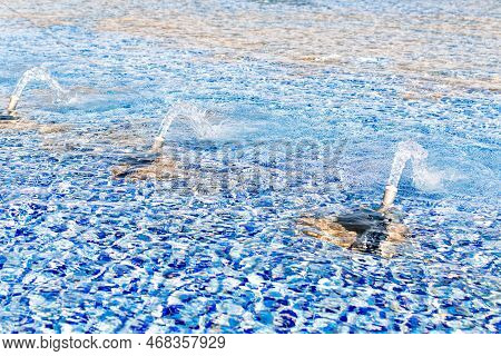 Clean Pure Water Surface Of A City Fountain. Refreshing Ecologically Water In Summer Heat Sunny Day.