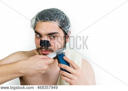 Bearded Man Shaving His Beard. Man Beauty Care.