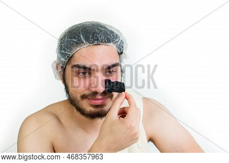 Young Caucasian Man Doing Facial Cleansing, Removing Pores Or Black Heads On Nose