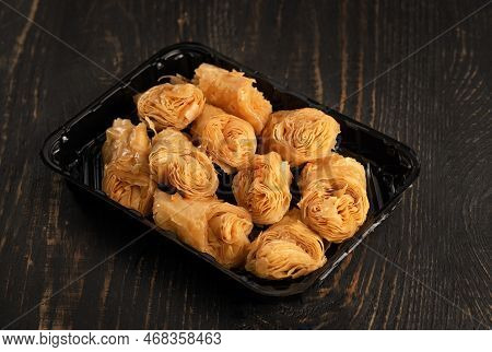 Turkish Ramadan Dessert Baklava With Walnuts In Mini Craft Packaging For A Store Or Delivery Service