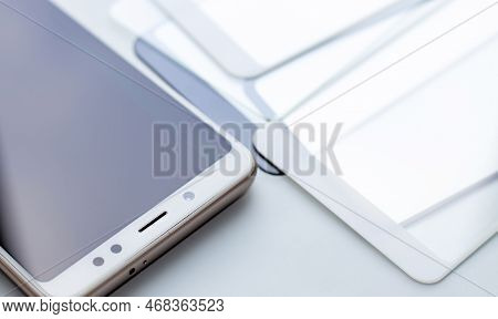 Maintenance And Repairing Smartphones. Many Tempered Glass Screen Protector